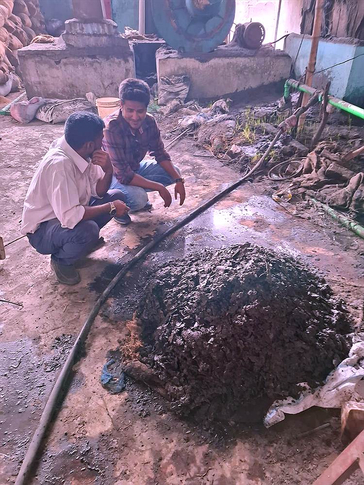 ChemWTS engineers inspecting ETP sludge at a textile site